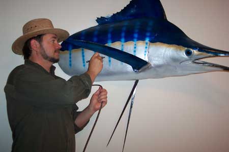 Angler's Art Taxidermy taxidermist Dennis custom paints a marlin